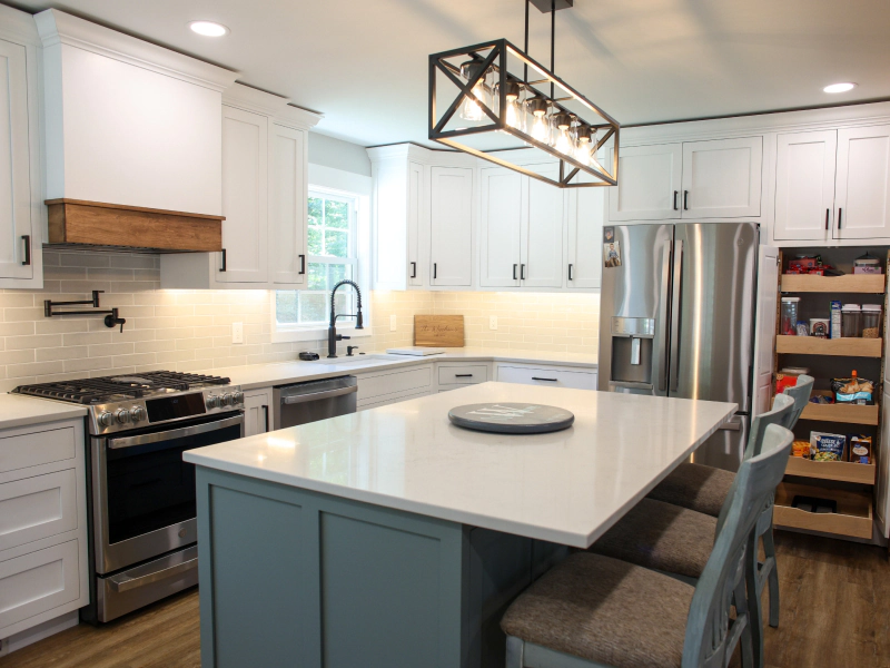 white cabinets with industrial blue kitchen island and wooden shelves